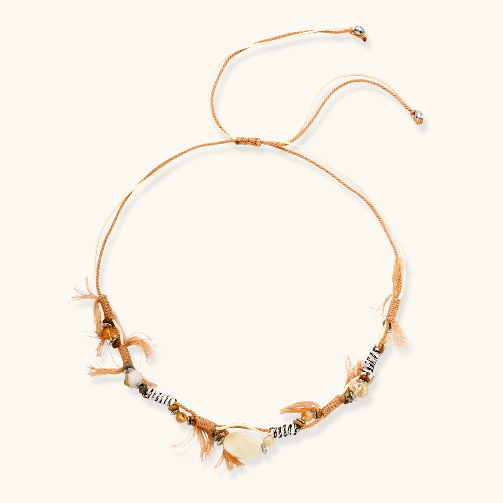 Adjustable brown cord necklace with citrine, coffee calcite beads and striped accents on white background.